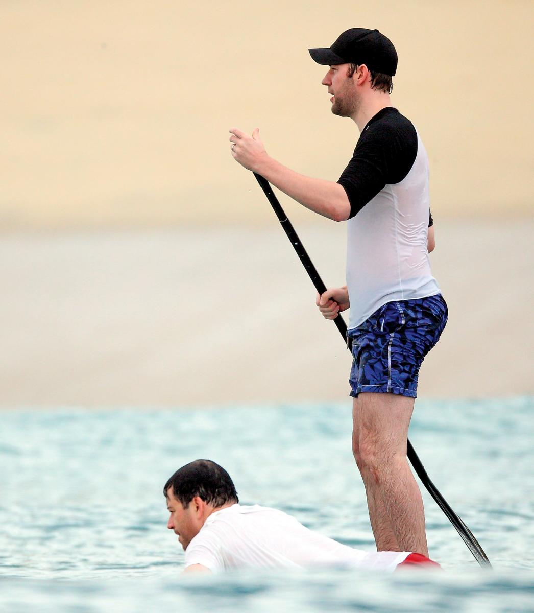 Krasinski and Kimmel paddleboarding