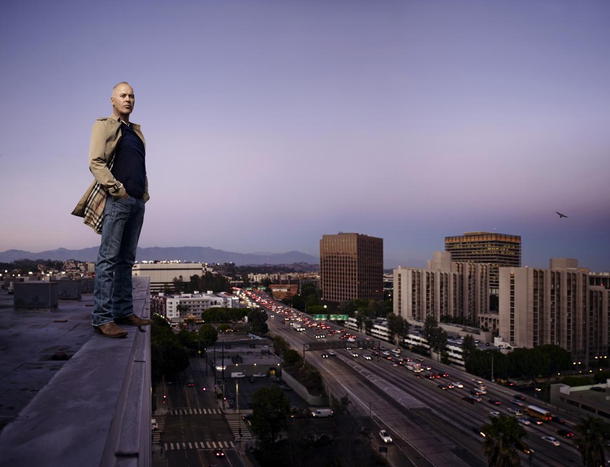 Michael Keaton posed on the edge of a rooftop